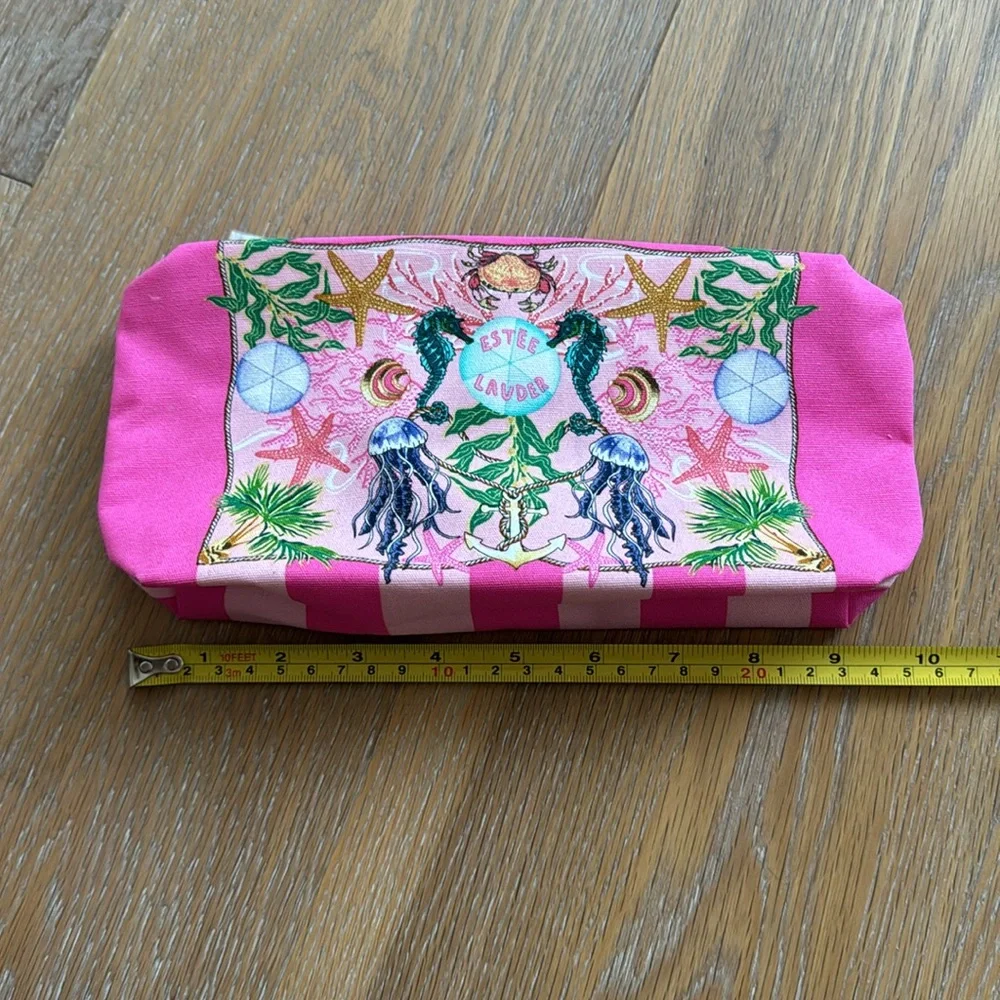 Estée Lauder pink zippered cosmetic bag with sea creatures and tropical trees